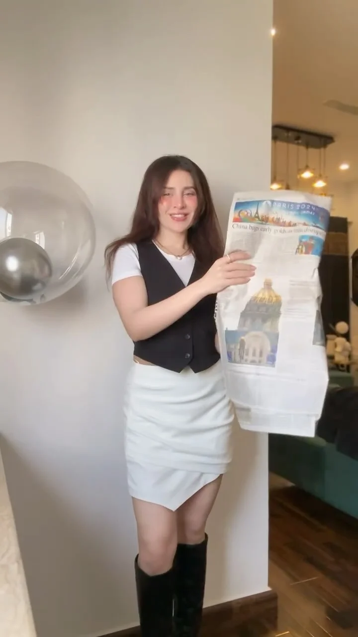 Neha Khan styling an autumn outfit in her original fashion reel